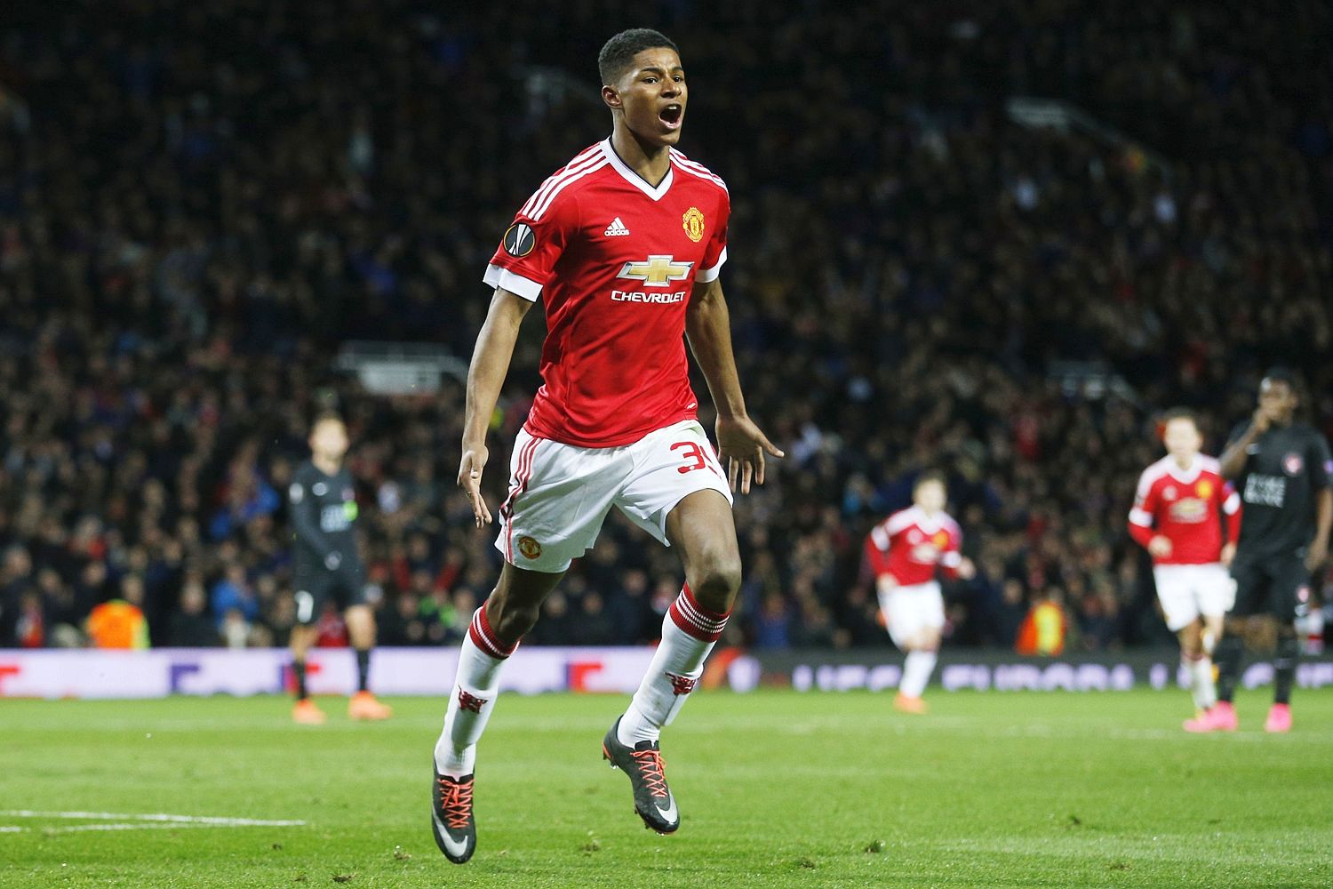 Marcus Rashford celebrates after scoring a goal for Manchester United.