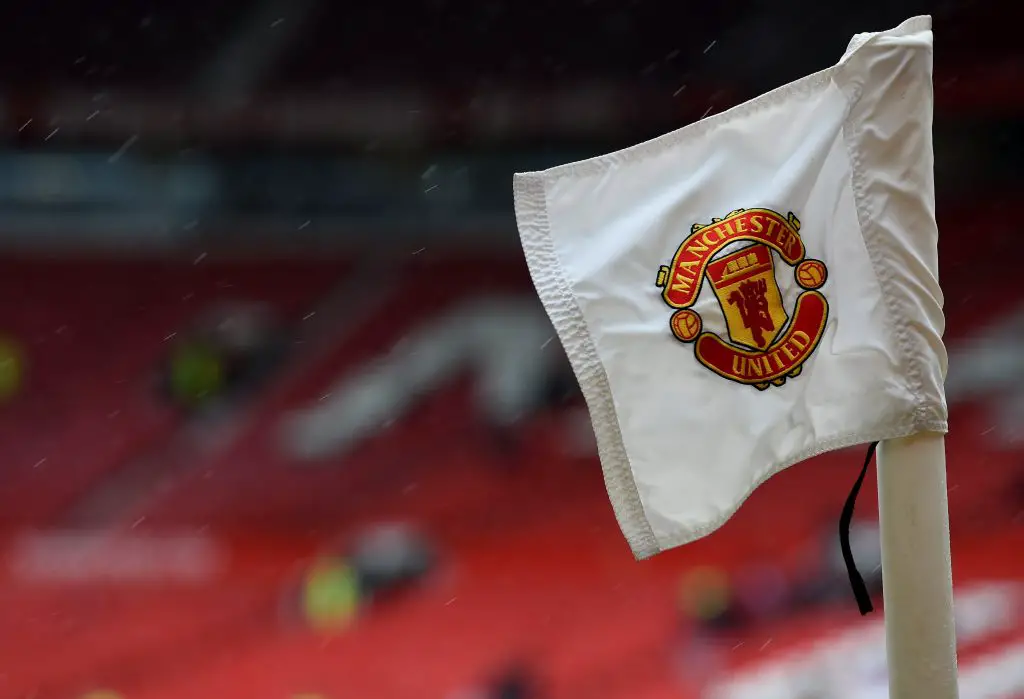 The Manchester United badge is seen on a corner flag ahead of the English Premier League football match between Manchester United and Manchester City at Old Trafford in Manchester, north west England on April 12, 2015. AFP PHOTO / PAUL ELLIS RESTRICTED TO EDITORIAL USE. No use with unauthorized audio, video, data, fixture lists, club/league logos or live services. Online in-match use limited to 45 images, no video emulation. No use in betting, games or single club/league/player publications. (Photo credit should read PAUL ELLIS/AFP via Getty Images)