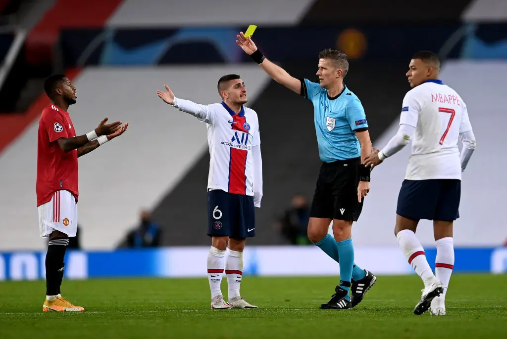 Fred was shown a yellow card in the first-half of the match for an attempted headbutt on PSG midfielder Leandro Paredes. (GETTY Images)