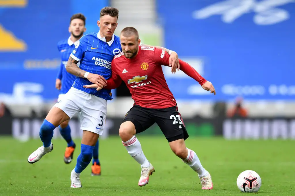 Ben White tussles for the ball with Manchester United left-back Luke Shaw. (GETTY Images)