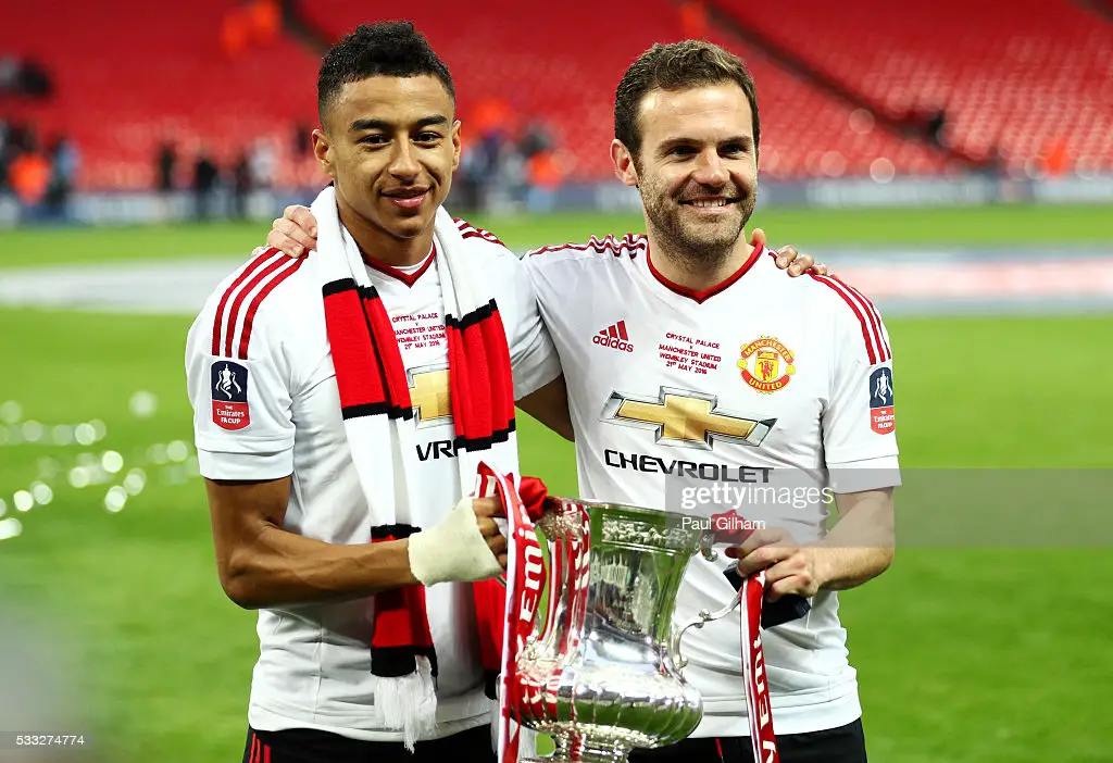 Jesse Lingard and Juan Mata. (Photo by Paul Gilham/Getty Images)