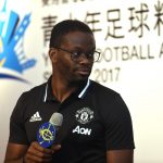 Former French soccer player Louis Saha speaks during a press conference.