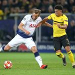 Tottenham Hotspur's Harry Kane vies for the ball with Borussia Dortmund's Jadon Sancho.