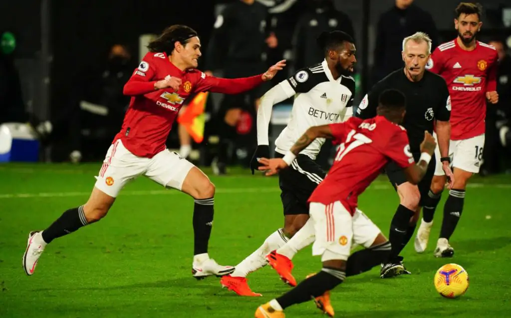 Edinson Cavani of Manchester United, ManU chases Andre Frank Zambo Anguissa of Fulham Fulham v Manchester United at Craven Cottage