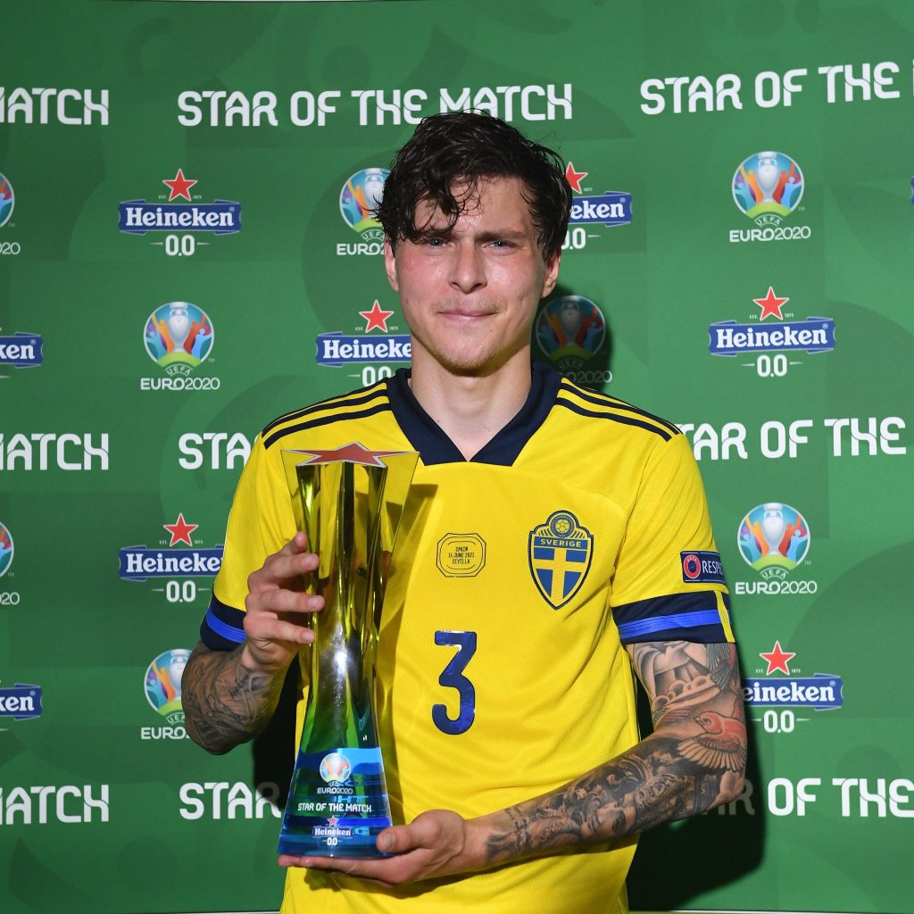 Manchester United player Victor Lindelof holding the EURO 2020 star of the match award.