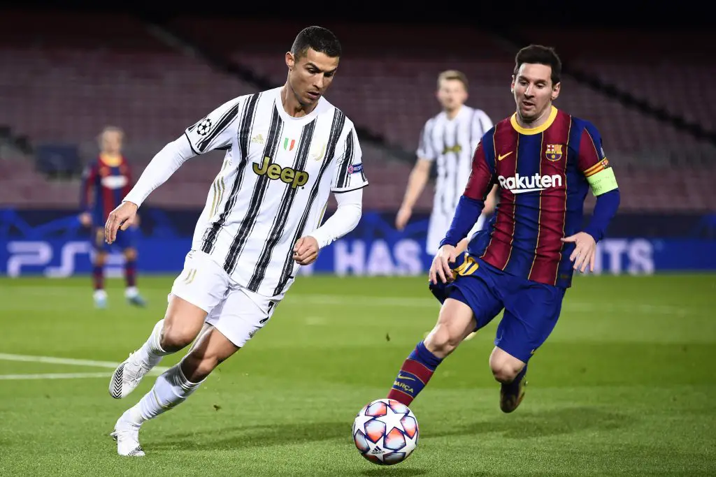 Cristiano Ronaldo in action for Juventus against Lionel Messi of Barcelona.