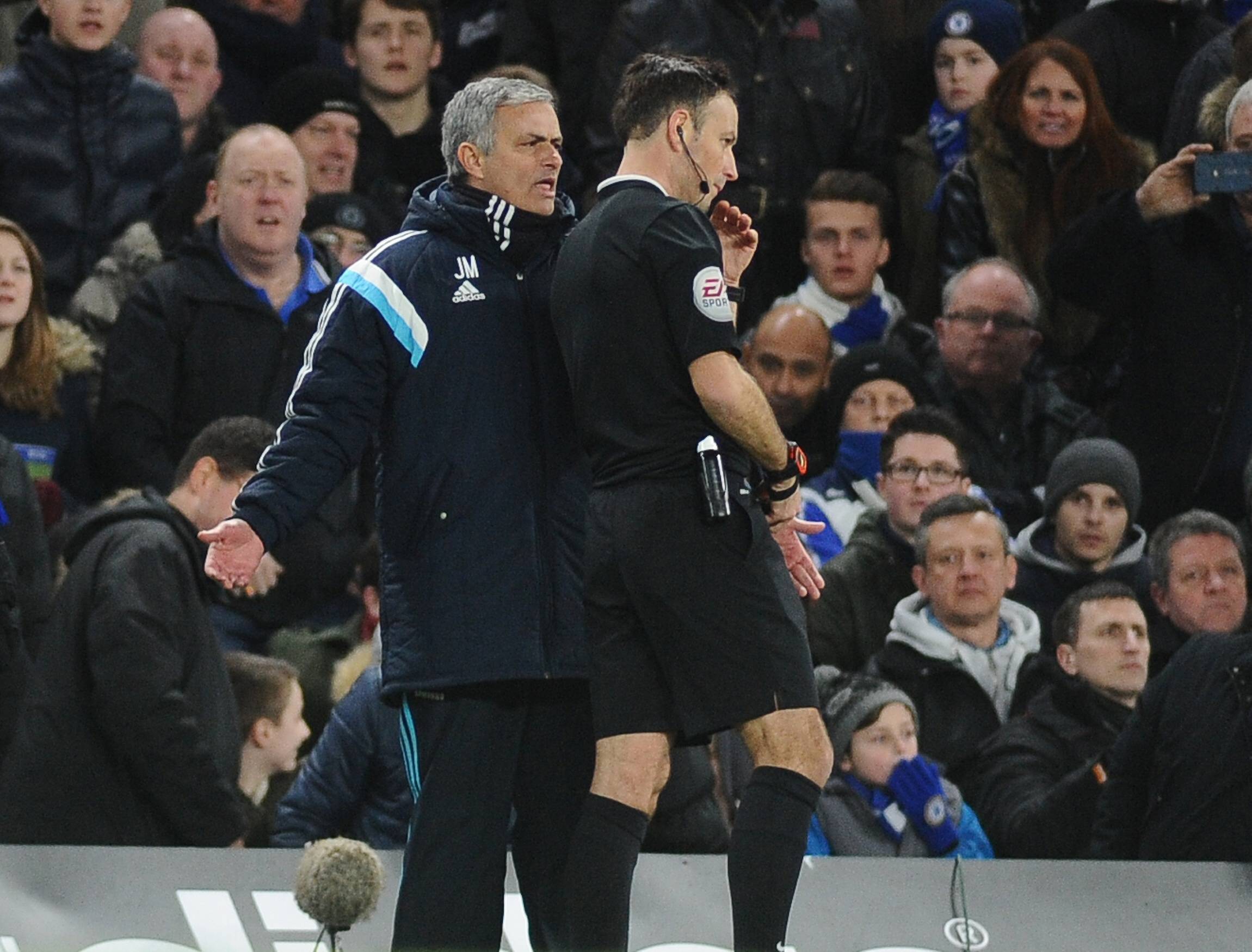 Jose Mourinho argues with Mark Clattenburg during a Premier League game.