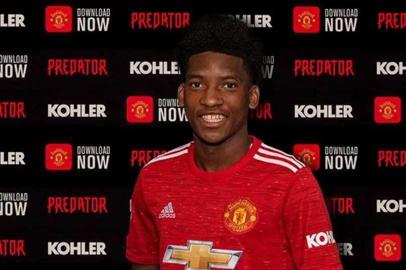 Willy Kambwala signs first pro contract with Manchester United. 