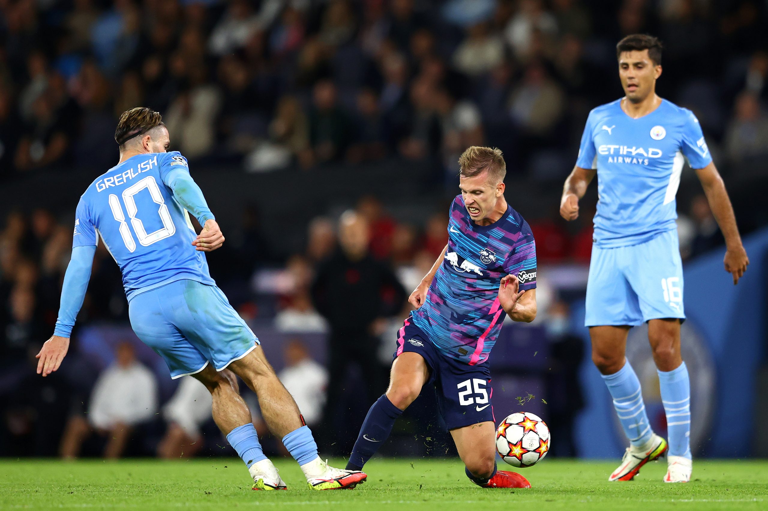 Dani Olmo of RB Leipzig and Jack Grealish of Manchester City battle for possession during the UEFA Champions League group A match between Manchester City and RB Leipzig.