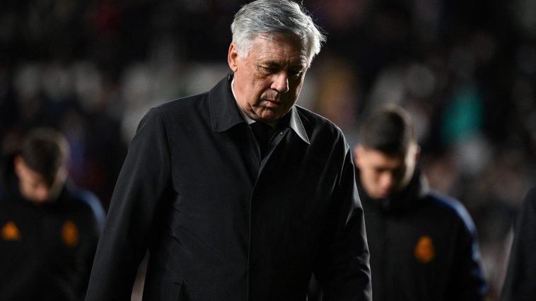 Real Madrid's Italian coach Carlo Ancelotti walks on the pitch. (Photo by GABRIEL BOUYS/AFP via Getty Images)