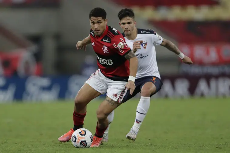 Brazil's Flamengo Joao Gomes (L) and Luis Amarilla vie for the ball during a Copa Libertadores game.