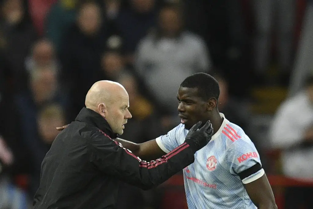 Manchester United's French midfielder Paul Pogba has a calf injury, says interim manager Ralf Rangnick. (Photo by OLI SCARFF/AFP via Getty Images)