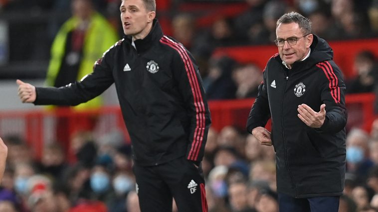 Darren Fletcher and Ralf Rangnick on the sidelines for Manchester United.