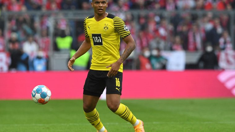 Manuel Akanji plays the ball during the German first division Bundesliga match between FC Bayern Munich and Borussia Dortmund. (Photo by Christof STACHE / AFP) / DFL REGULATIONS PROHIBIT ANY USE OF PHOTOGRAPHS AS IMAGE SEQUENCES AND/OR QUASI-VIDEO (Photo by CHRISTOF STACHE/AFP via Getty Images)