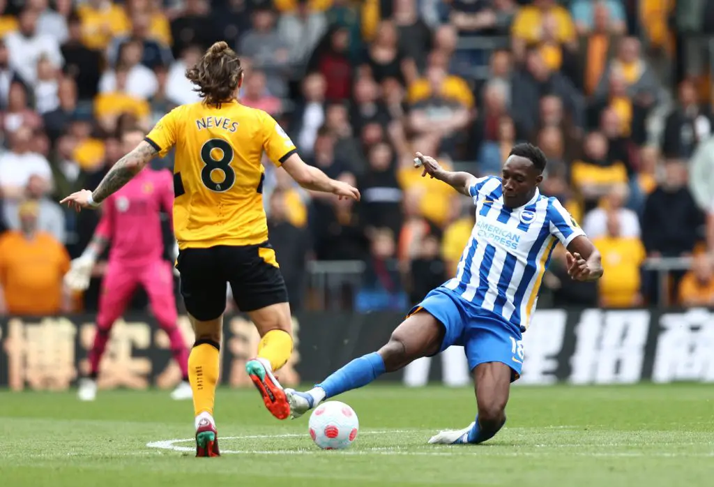 WOLVERHAMPTON, ENGLAND - APRIL 30: Danny Welbeck of Brighton & Hove Albion is challenged by Ruben Neves of Wolverhampton Wanderers  during the Premier League match between Wolverhampton Wanderers and Brighton & Hove Albion at Molineux on April 30, 2022 in Wolverhampton, England
