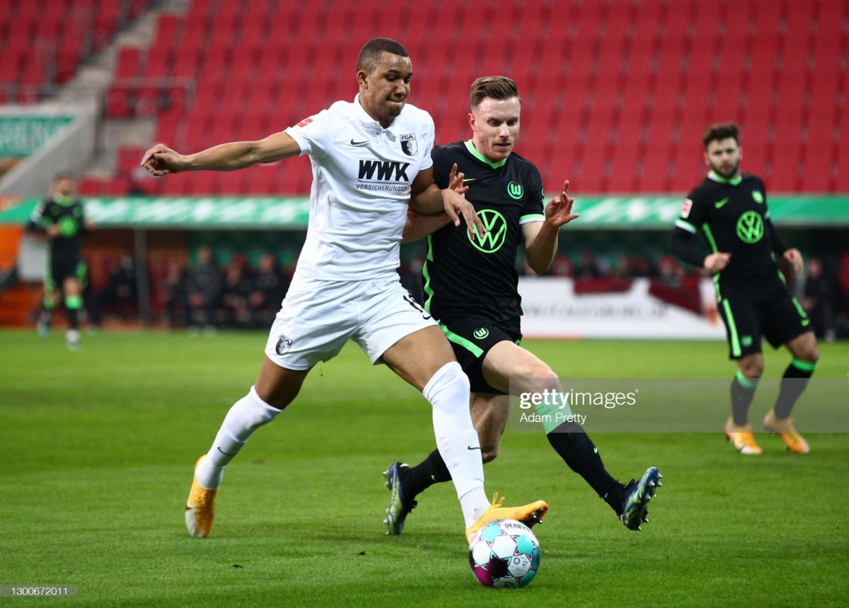 Felix Uduokhai of FC Augsburg and Yannick Gerhardt of VfL Wolfsburg battle for possession. (Photo by Adam Pretty/Getty Images)
