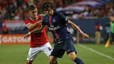 Adrien Rabiot of Paris Saint-Germain holds off Andreas Pereira of Manchester United.