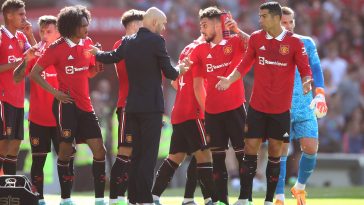 Manchester United manager, Erik ten Hag, chats with Cristiano Ronaldo of Manchester United.