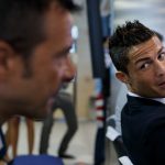 Cristiano Ronaldo (R) speaks with agent, Jorge Mendes. (Photo by Gonzalo Arroyo Moreno/Getty Images)