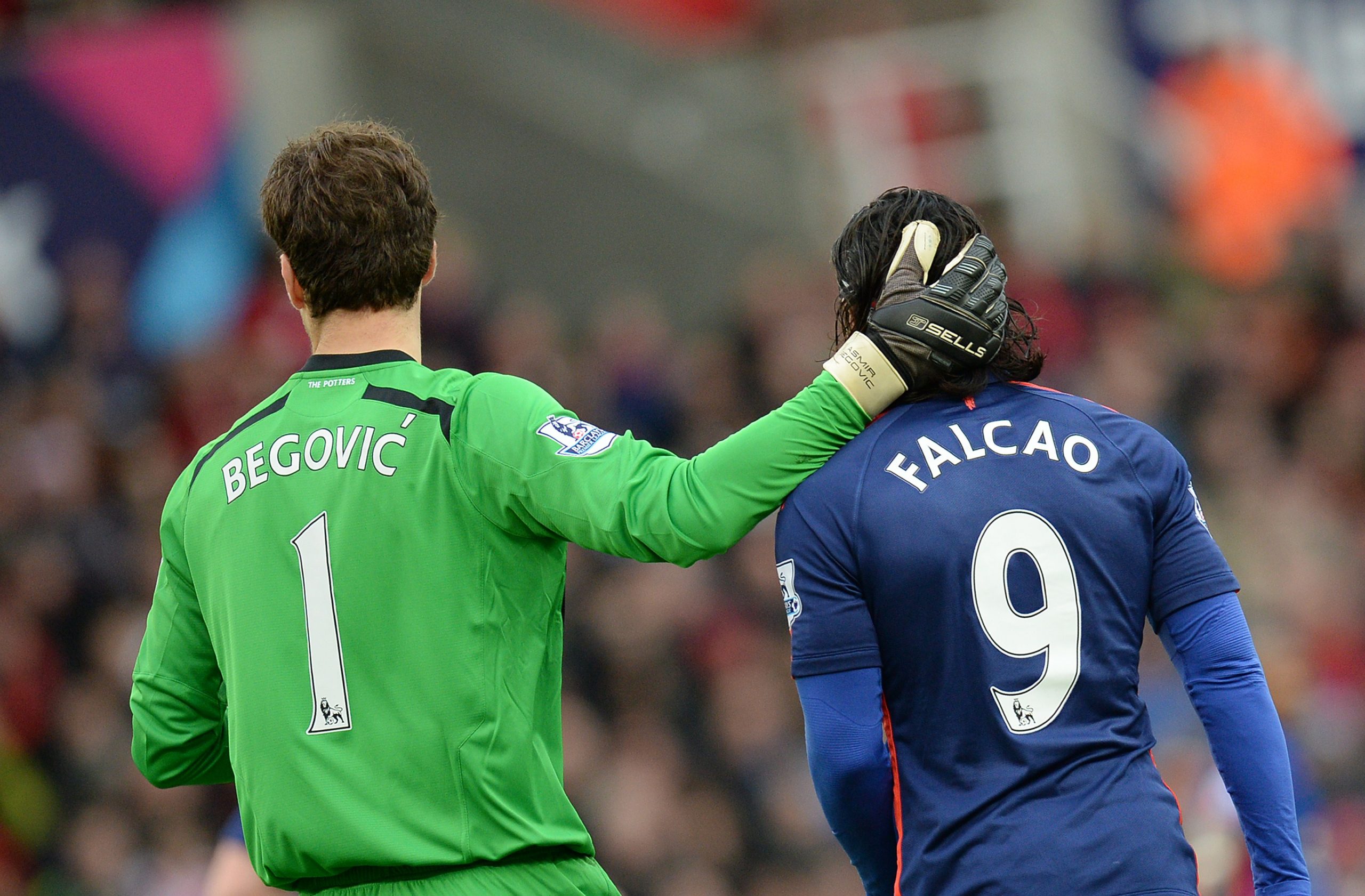 Asmir Begovic of Stoke City with Manchester United's Radamel Falcao.