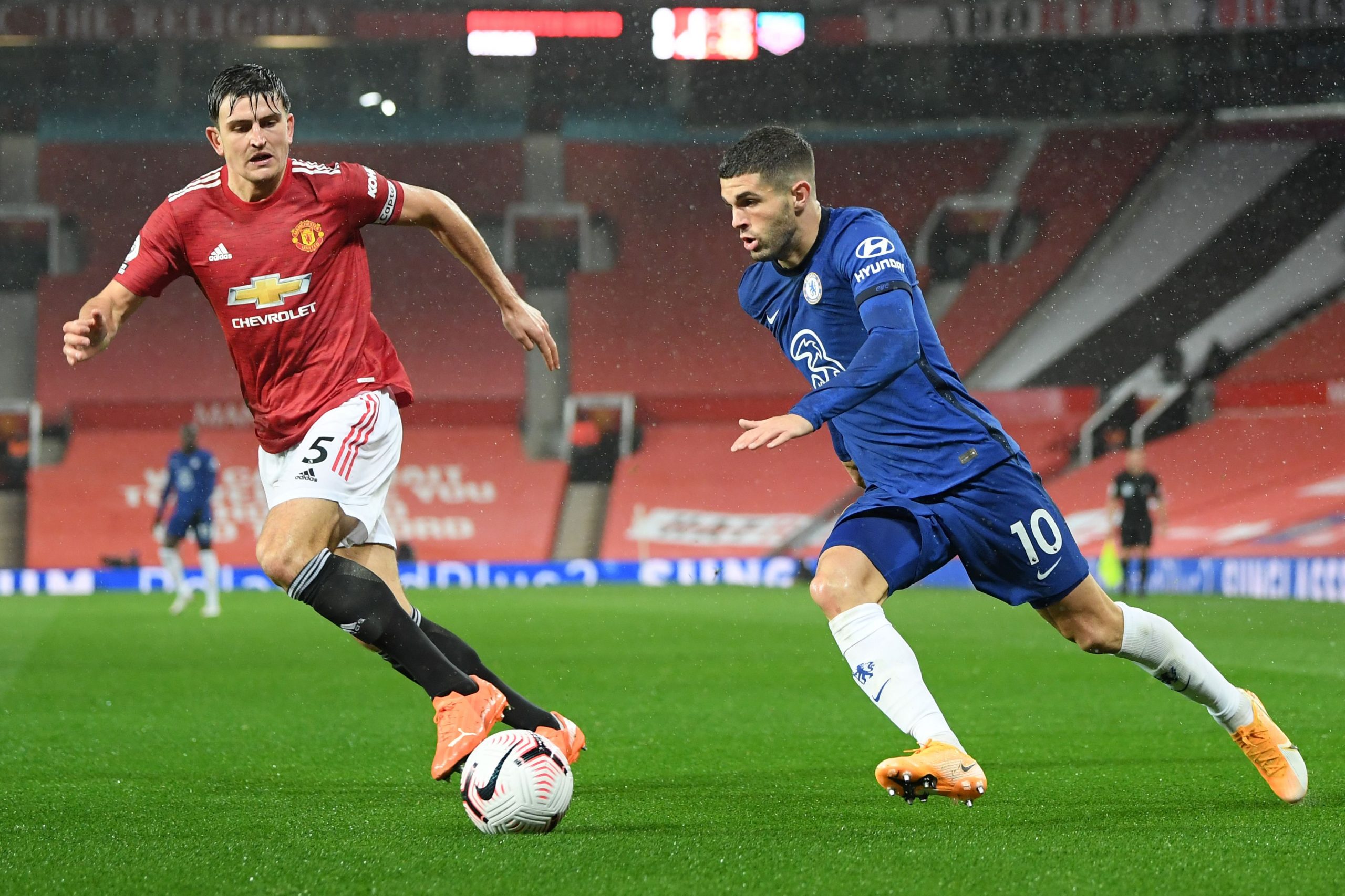 Harry Maguire tries to chase Chelsea's Christian Pulisic.