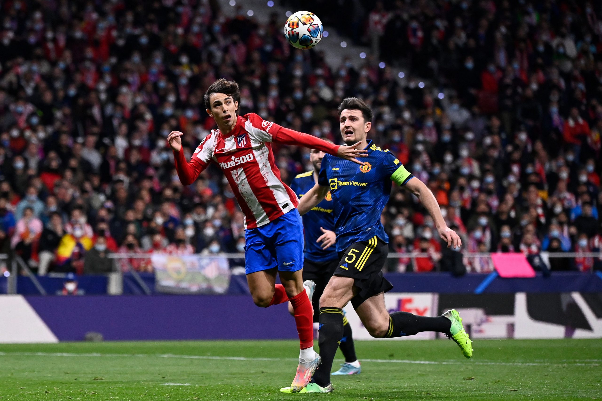 Atletico Madrid's Joao Felix shoots past Manchester United's Harry Maguire.