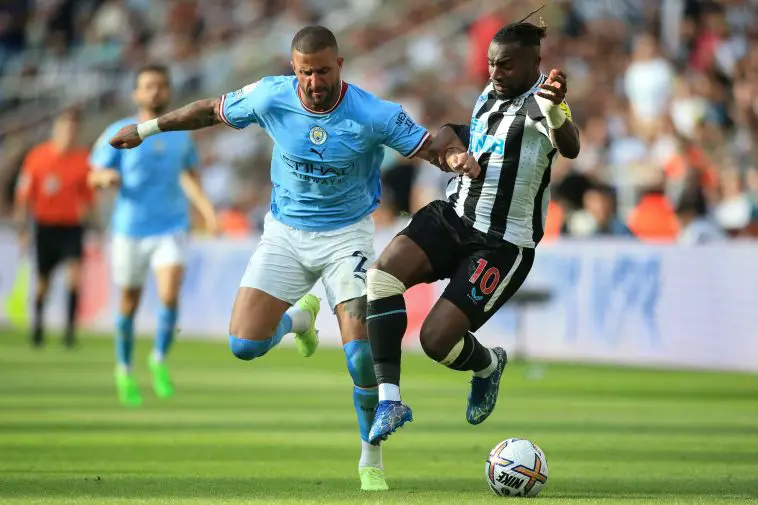 Manchester City's Kyle Walker fights for the ball with Newcastle United's Allan Saint-Maximin. (Photo by LINDSEY PARNABY/AFP via Getty Images)