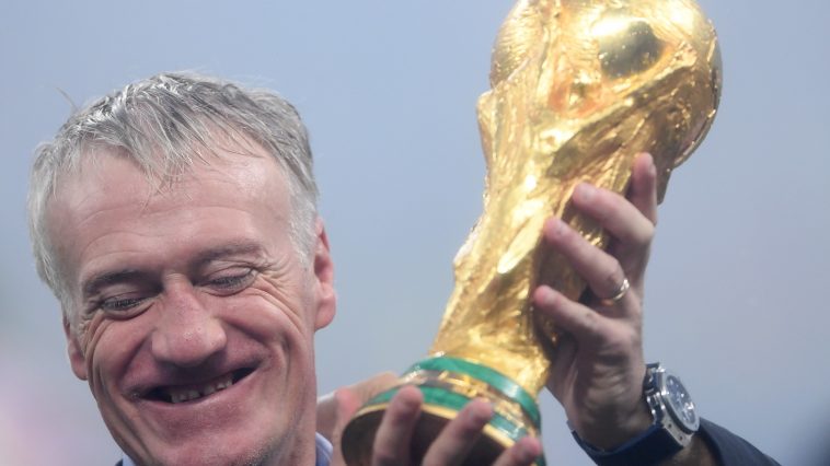 Didier Deschamps of France holds the World Cup trophy.