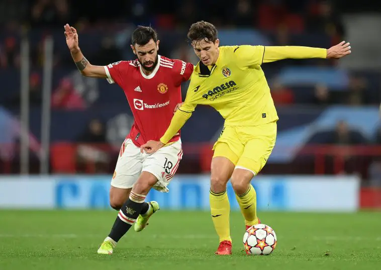 Pau Torres of Villarreal CF battles for possession with Bruno Fernandes of Manchester United during a UEFA Champions League group F match.