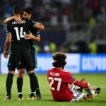 Casemiro of Real Madrid and Marco Asensio celebrate victory together after Marouane Fellaini of Manchester United is dejected in the UEFA Super Cup final.