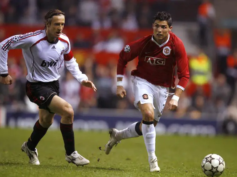 Cristiano Ronaldo vies for the ball against AC Milan's Massimo Ambrosini during his first spell with the Old Trafford outfit.