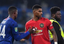 Marcus Rashford shakes hands with Chelsea defender, Marc Guehi. (Photo by BEN STANSALL/AFP via Getty Images)