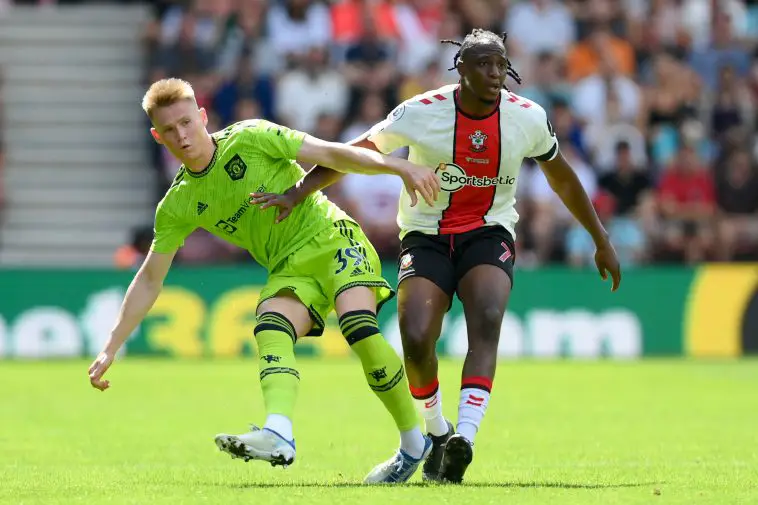 Scott McTominay of Manchester United is challenged by Joe Aribo of Southampton.