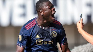 Brian Brobbey reacts after scoring a goal for Ajax. (Photo by JEROEN PUTMANS/ANP/AFP via Getty Images)