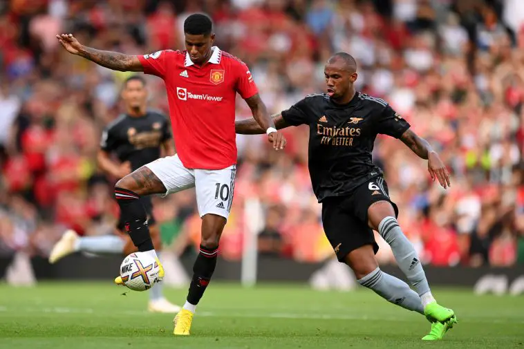 Marcus Rashford of Manchester United is challenged by Gabriel Magalhaes of Arsenal.