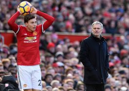 Jose Mourinho watches as Manchester United defender, Victor Lindelof, takes a throw in.