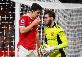 Harry Maguire conversing with Manchester United teammate, David de Gea. (