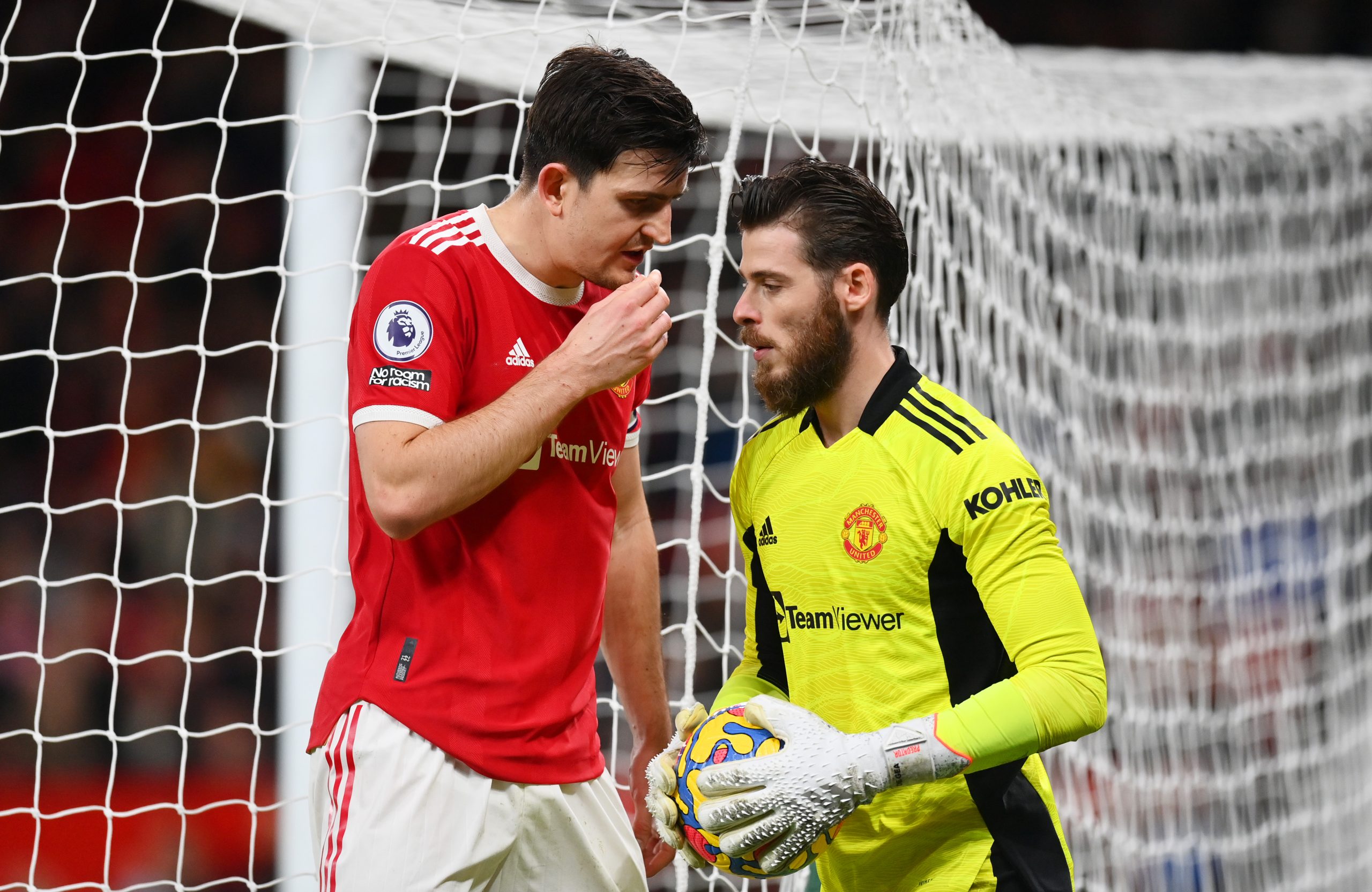 Harry Maguire conversing with Manchester United teammate, David de Gea. (