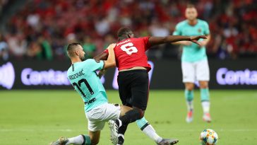 Paul Pogba of Manchester United and Marcelo Brozovic of Inter Milan compete for the ball during a friendly in 2019.
