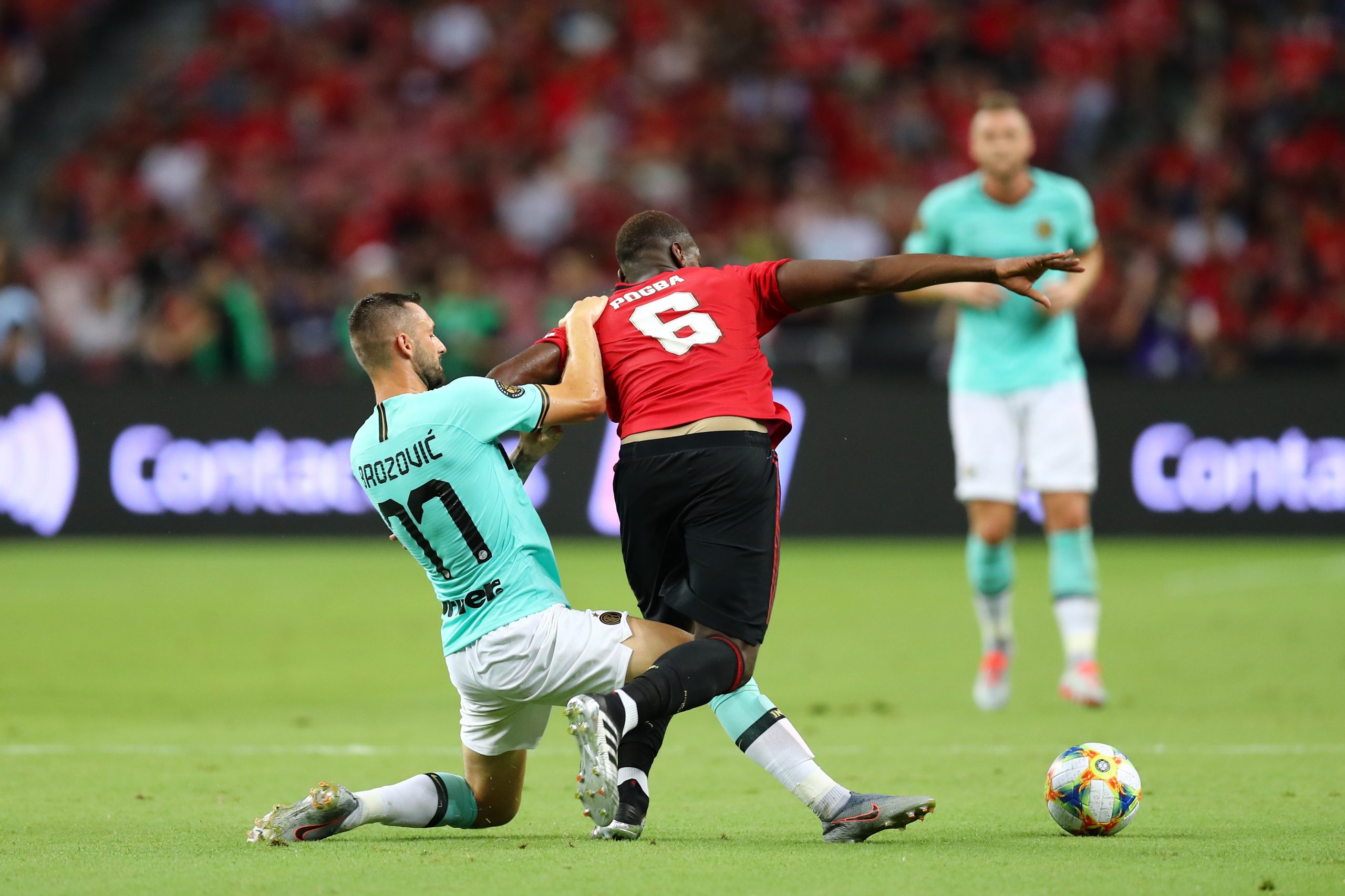 Paul Pogba of Manchester United and Marcelo Brozovic of Inter Milan compete for the ball during a friendly in 2019.