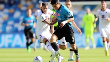 Kim Min-jae of SSC Napoli battles for possession with Antonio Sanabria of Torino FC.