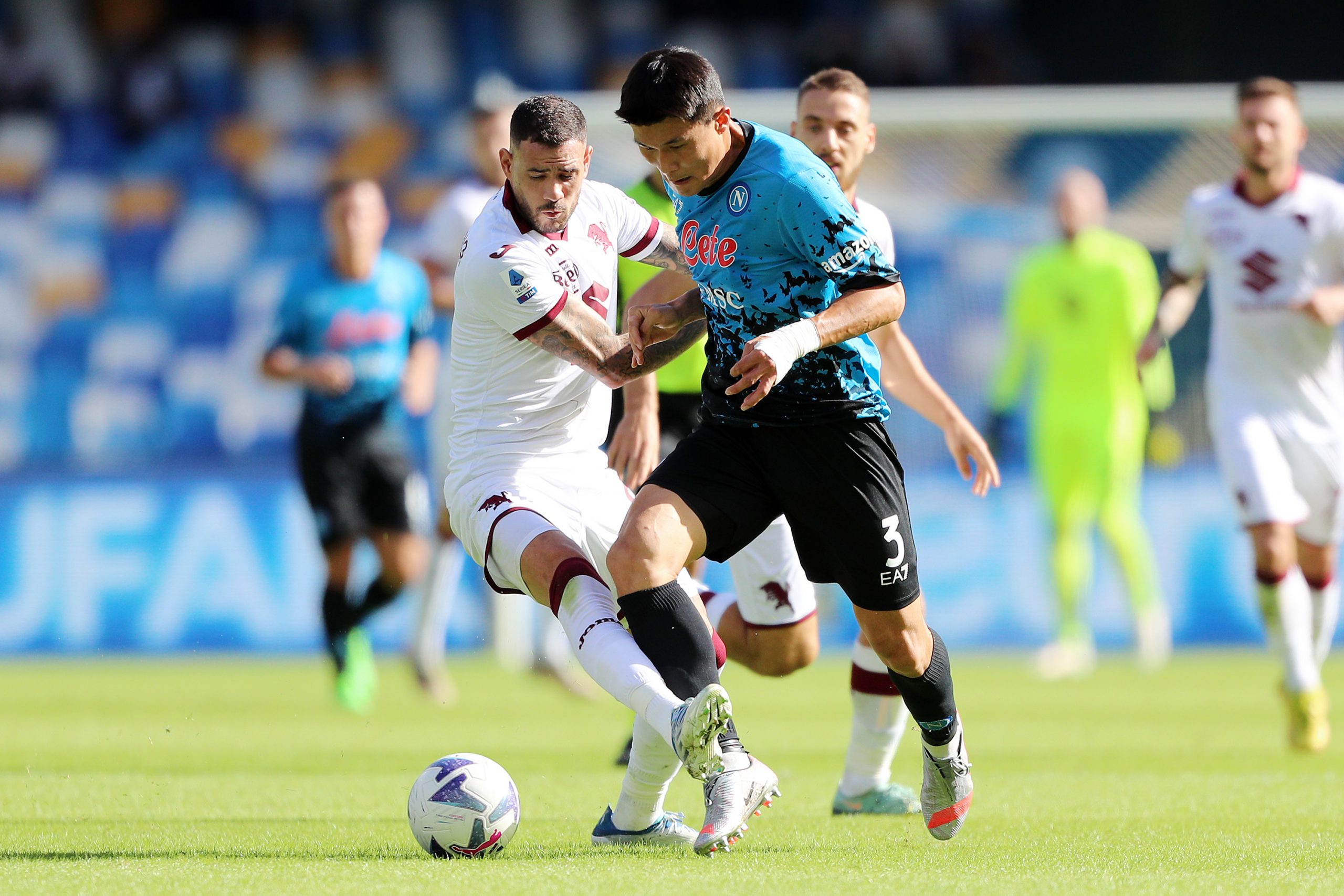 Kim Min-jae of SSC Napoli battles for possession with Antonio Sanabria of Torino FC.