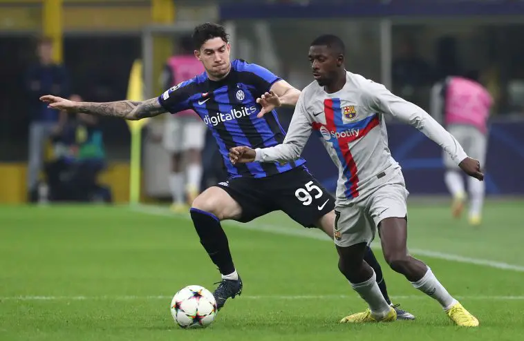 Ousmane Dembele of FC Barcelona is challenged by Alessandro Bastoni of Inter Milan in a UEFA Champions League game.