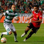 Omonia's Fotis Papoulis and Manchester United's Casemiro vie for the ball during a UEFA Europa League group match.