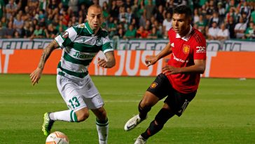 Omonia's Fotis Papoulis and Manchester United's Casemiro vie for the ball during a UEFA Europa League group match.