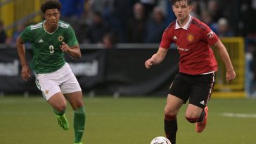 Louis Jackson of Manchester United and Reece Evans of Northern Ireland during the NI Super Cup match.