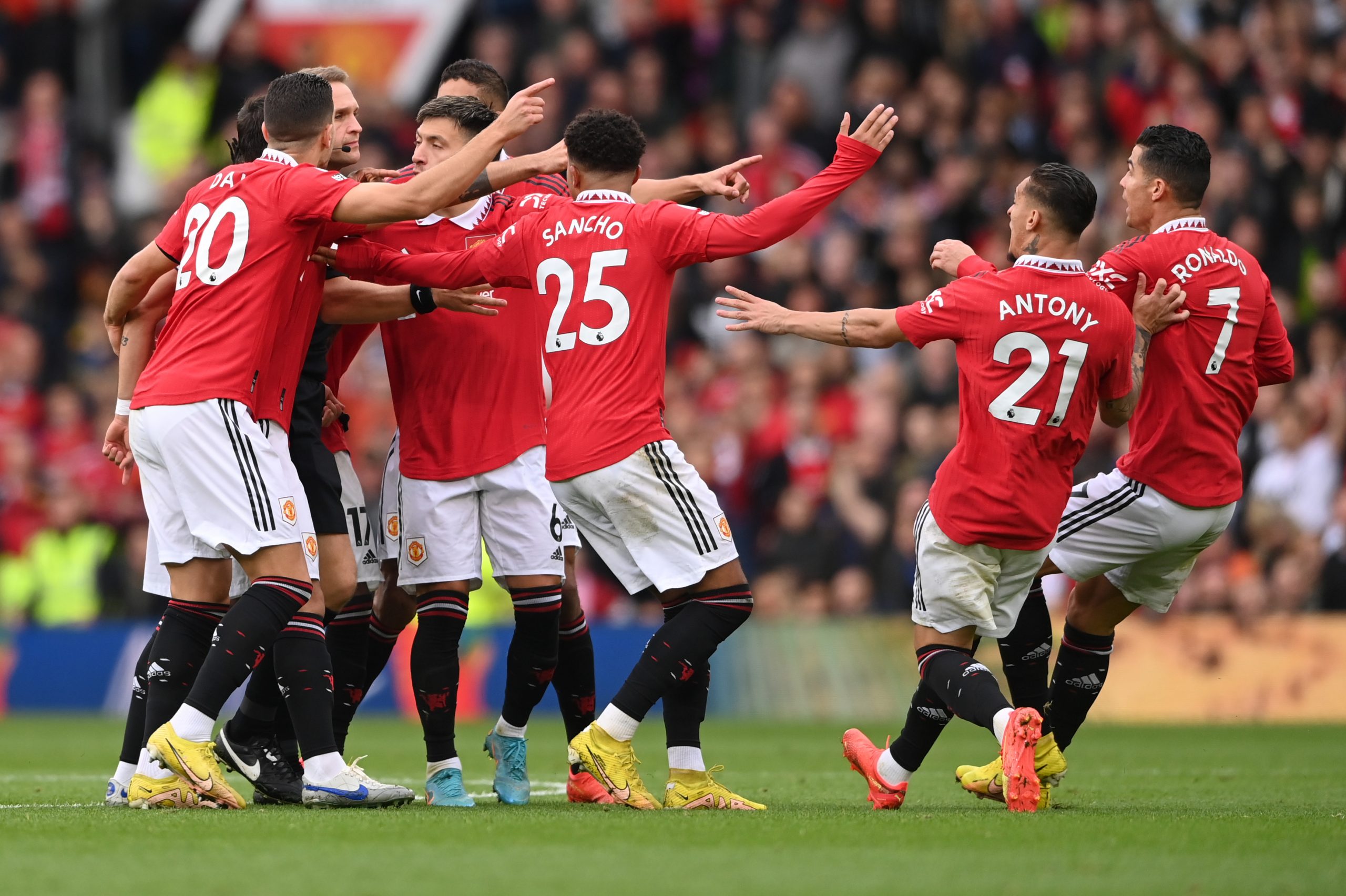 Manchester United players protest after referee Craig Pawson disallows Cristiano Ronaldo's goal in a league game against Newcastle United in October 2022.