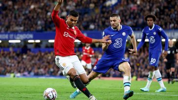 Casemiro of Manchester United battles for possession with Mateo Kovacic of Chelsea.