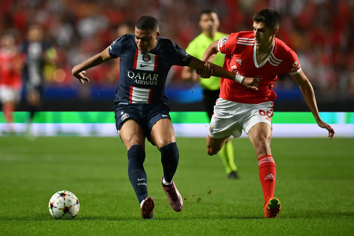 Paris Saint-Germain's Kylian Mbappe is challenged by Benfica's Antonio Silva during a UEFA Champions League game. 