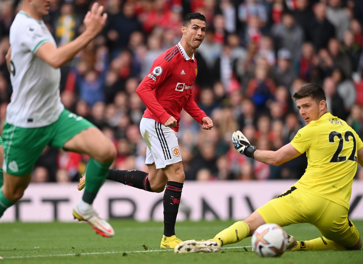 Cristiano Ronaldo of Manchester United takes a shot past Newcastle United's Nick Pope.